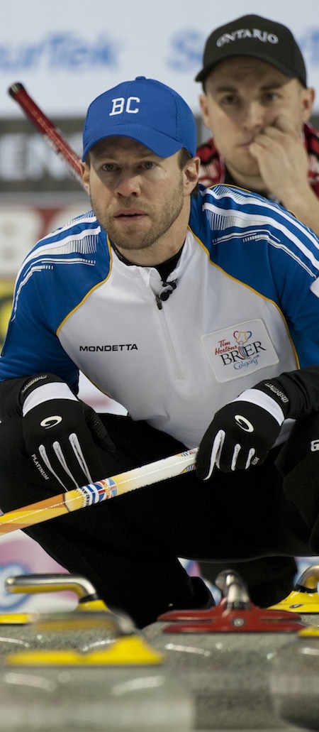 B.C. skip Jim Cotter, left, watches a shot as Ontario skip Mark Kean looks on. (Photo, Curling Canada/Michael Burns)