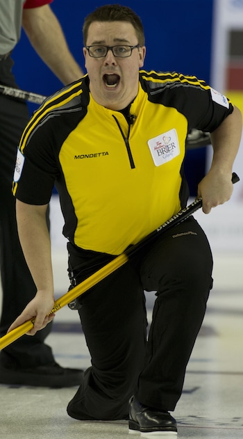 New Brunswick skip Jeremy Mallais encourages his sweepers in Saturday night's win over the Northwest Territories. (Photo, Curling Canada/Michael Burns)