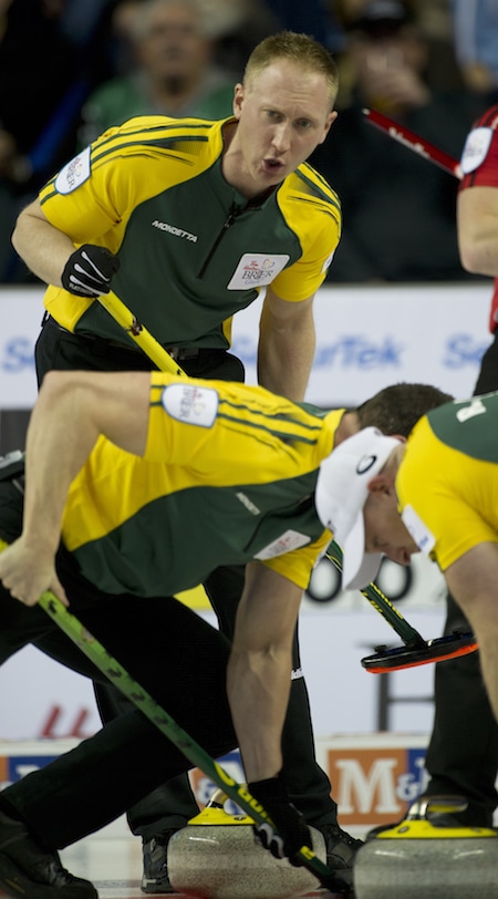 Northern Ontario skip Brad Jacobs guides sweepers E.J. Harnden, left, and Ryan Harnden. (Photo, Curling Canada/Michael Burns)