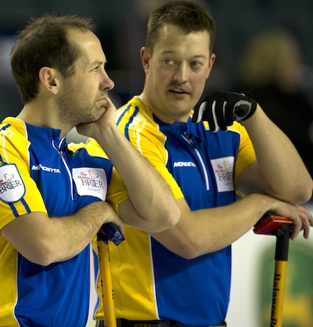 Alberta's Brent Laing, left, and Ben Hebert ponder the situation on Tuesday. (Photo, Curling Canada/Michael Burns)