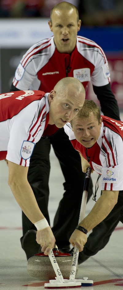 Team Canada skip Pat Simmons guides sweepers Nolan Thiessen, left, and Carter Rycroft. (Photo, Curling Canada/Michael Burns)