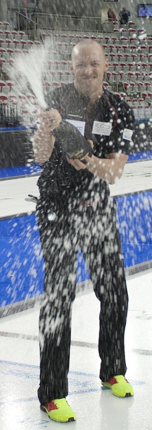 Nolan Thiessen of Team Canada pops the bubbly. (Photo, CCA/Michael Burns)