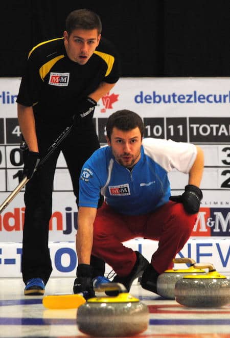 Quebec vice-skip Alex Cormier, right, checks out the line of a shot as New Brunswick vice Andrew Burgess looks on. (Photo, Amanda Rumboldt)