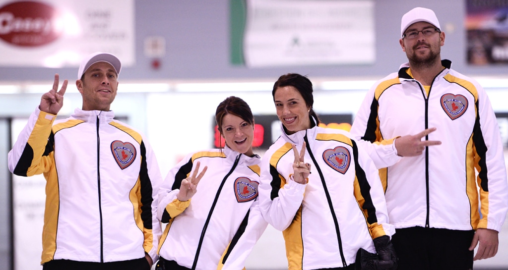 Manitoba’s Kyle Einarson, Kerri Einarson, Jennifer Clark-Fouire and Jared Kolomaya celebrate after an exciting win in Draw 10 at the 2015 Canadian Mixed Curling Championship in North Bay, Ont. (Brian Doherty Photography)