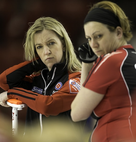 Ontario skip Julie Hastings and lead Katrina Collins look over the house during action on Wednesday. (Photo, CCA/Andrew Klaver)