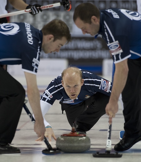 Scotland's Ewan MacDonald delivers rock to sweepers Ruairidh Greenwood, left, and Euan Byers. (Photo, Curling Canada/Michael Burns)