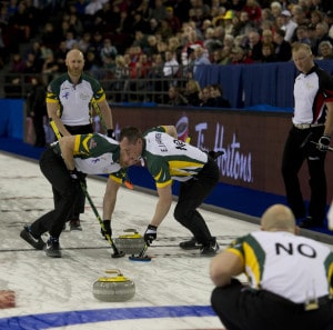 Northern Ontario sweeps their final rock of the 10th end to the top four. (Photo, Curling Canada/Michael Burns Photo)