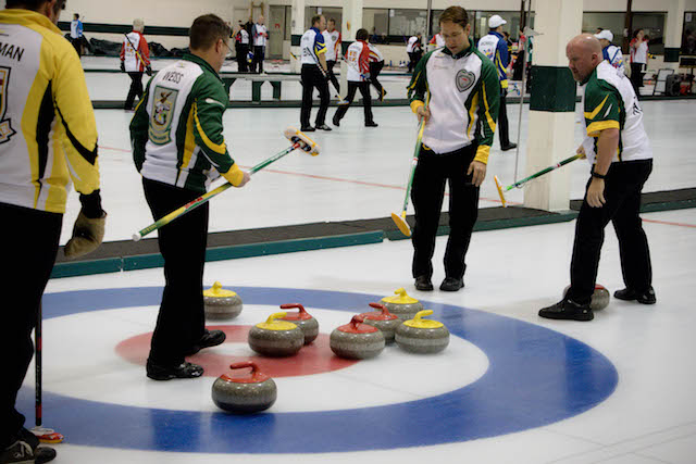 Team Northern Ontario discusses their next shot at the 2016 Travelers Curling Club in Kelowna, B.C. (Curling Canada/Jessica Krebs photo)