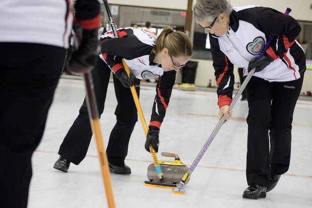 Mother-and-daughter Ontario sweepers, Lisa Jones and Susan Cully (Curling Canada/Jessica Krebs photo)