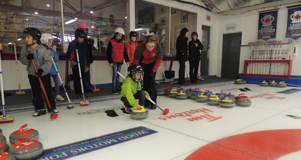 Rocks & Rings instructor Cathlia Ward works with a young students from Summerhill School at the Gage Golf & Country Club in Oromocto, N.B. (Photo courtesy C. Ward)