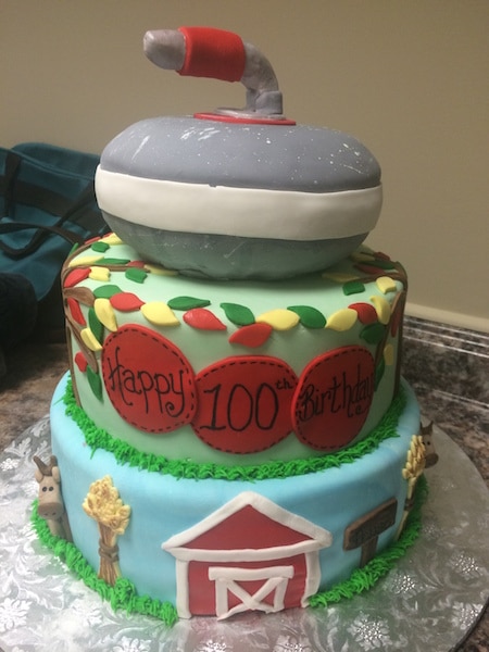 A specially designed cake reflects the life of 100-year-old Lloyd Campbell: the farm, the family tree of life and a curling rock (Photo courtesy of the Campbell family)