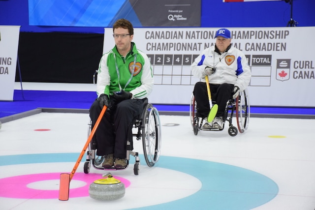 Darwin Bender (SK) and Gerry Austgarden (BC) in action during the Page Playoff 3 vs 4 game at the 2015 Canadian Wheelchair Curling Championship (Photo Morgan Daw)
