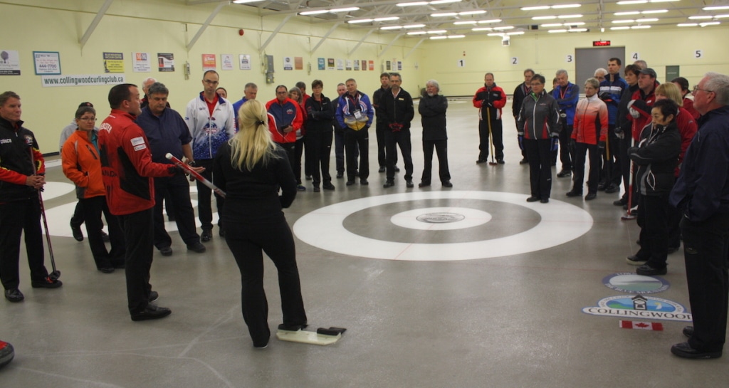 Competitive curler Danielle Inglis prepares to demonstrate delivery techniques during a technical update session facilitated by National Development Coach Paul Webster and Curl Atlantic’s Helen Radford (Photo Curling Canada/Brian Chick)