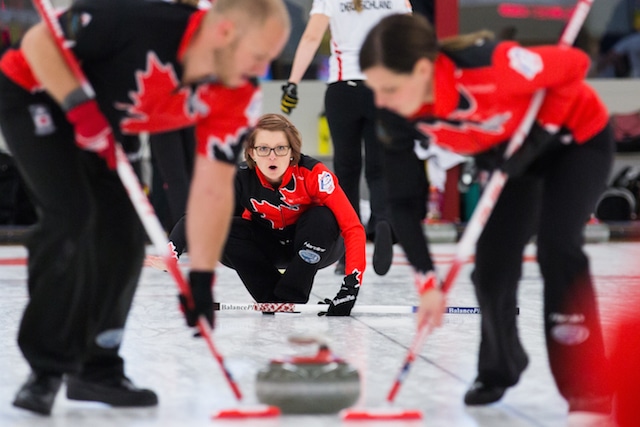 Canada's Jolene Campbell, Chris Haichert and Teejay Haichert in action at the 2015 World Mixed Curling Championship in Berne, Switzerland (Photo WCF/Céline Stucki)