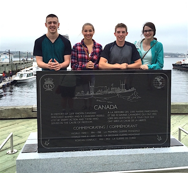 (From left to right) Youth Olympians Tyler Tardi, Karlee Burgess, Sterling Middleton and Mary Fay stop for a moment of national pride while exploring the Halifax waterfront. (Photo courtesy Karlee Burgess)