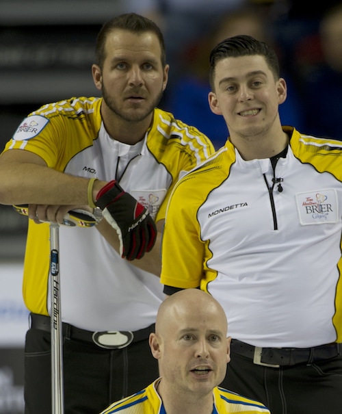Colin Hodgson (right), with Derek Samagalski and Alberta skip Kevin Koe at the 2015 Tim Hortons Brier (Curling Canada/Michael Burns photo)