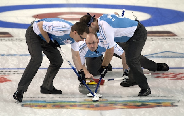 Kamloops B.C.Mar8_2014.Tim Hortons Brier.Quebec skip Jean-Michel Menard,Manitoba,lead Phillipe Menard,second Eric Sylvain.CCA/michael burns photo