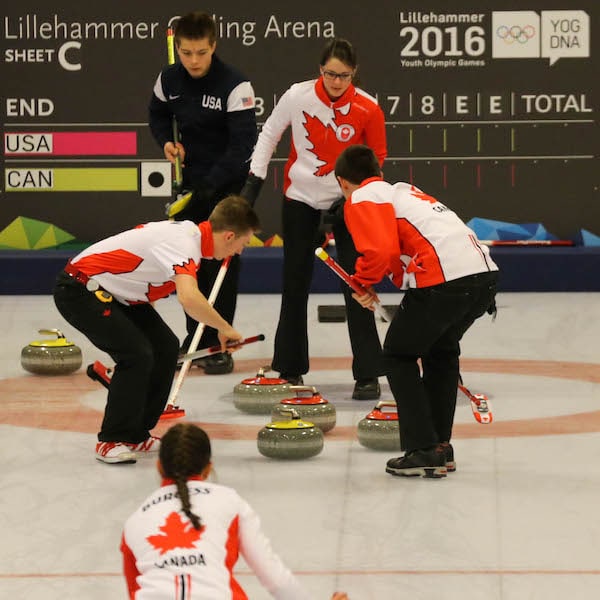 Sweepers Sterling Middleton and Tyler Tardi follow Karlee Burgess's rock into the house as skip Mary Fay calls line in the gold medal game of the 2016 Youth Olympics in Lillehammer, Norway (WCF/Richard Gray photo)