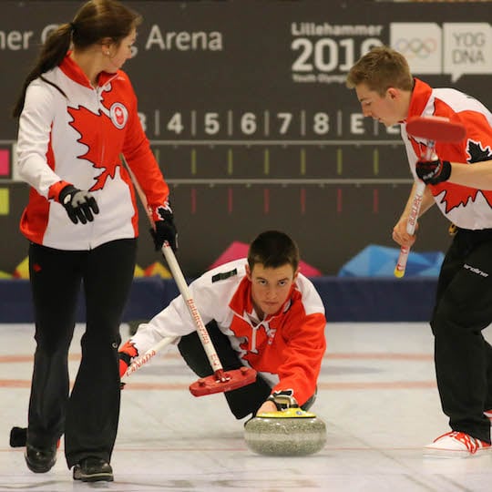 Tyler Tardi delivers his rock assisted by sweepers Karlee Burgess and Sterling Middleton at the 2016 Youth Olympic Games in Lillehammer, Norway (WCF/Richard Gray photo)