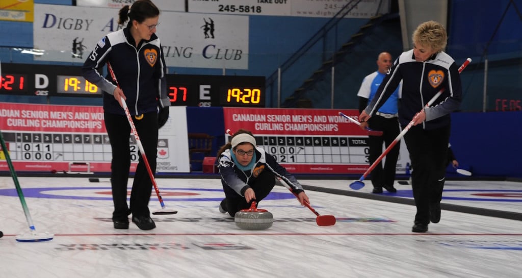Nova Scotia’s Colleen Jones delivers her rock to sweepers Mary Sue Radford and Kim Kelly on the first day of action at the 2016 Everest Canadian Senior Curling Championships (Curling Canada/Mike Lewis photo)