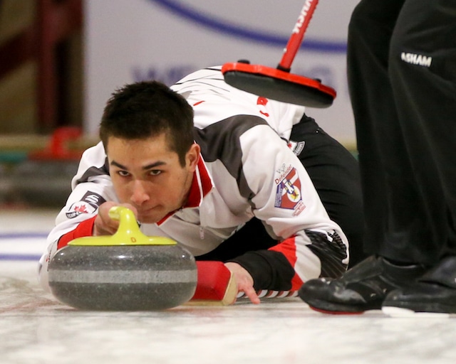 Team Canada third Colton Lott keeps his eyes on the broom during Monday’s game against Sweden at the 2016 World Junior Curling Championships in Taarnby, Denmark (WCF/Richard Gray photo)