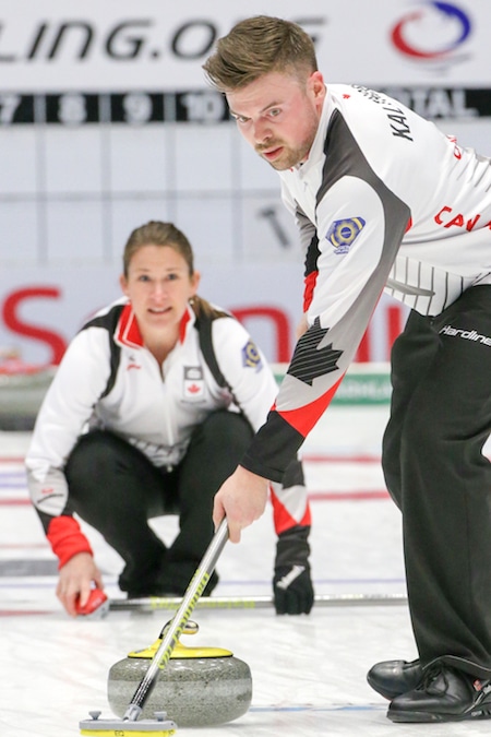 Canada's Marliese Kasner, left, looks at her shot as it's being swept by Dustin Kalthoff during Sunday's win over France. (Photo, World Curling Federation/Richard Gray)