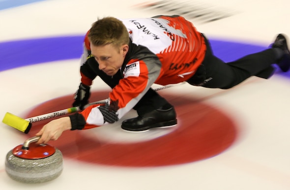 Marc Kennedy delivers a shot during Canada's win over Germany on Tuesday. (Photo, World Curling Federation/Richard Gray)