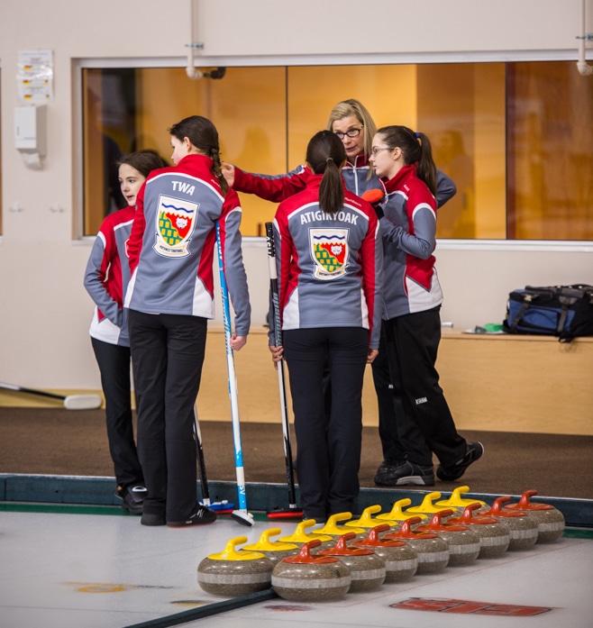 Coach Wendy Miller talks to her Team Northwest Territories team during their first game (Detour Photography)