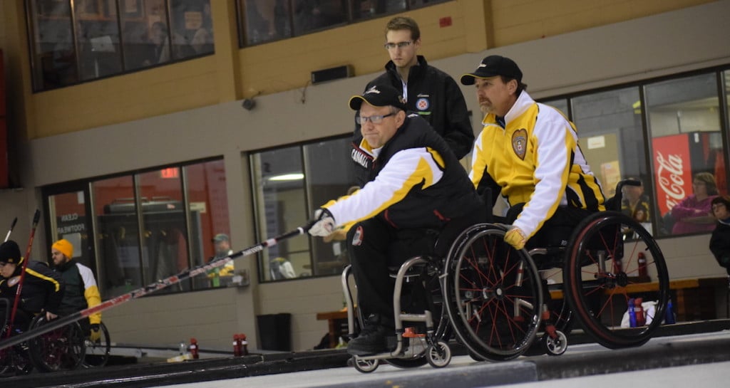 Manitoba's Dennis Thiessen and Mark Wherret in action at the Callie Curling Club in Regina, Sask. during first-day action at the 2016 Canadian Wheelchair Curling Championship (Curling Canada/Morgan Daw photo)