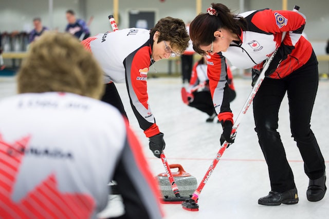 Cheryl Hall and Judy Pendergast bring another rock into the house during action at the 2016 World Senior Curling Championships in Karlstad, Sweden (WCF/Céline Stucki photo)