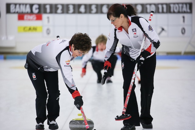 Cheryl Hall and Judy Pendergast in action at the 2016 World Senior Curling Championships in Karlstad, Sweden (WCF/Céline Stucki photo)