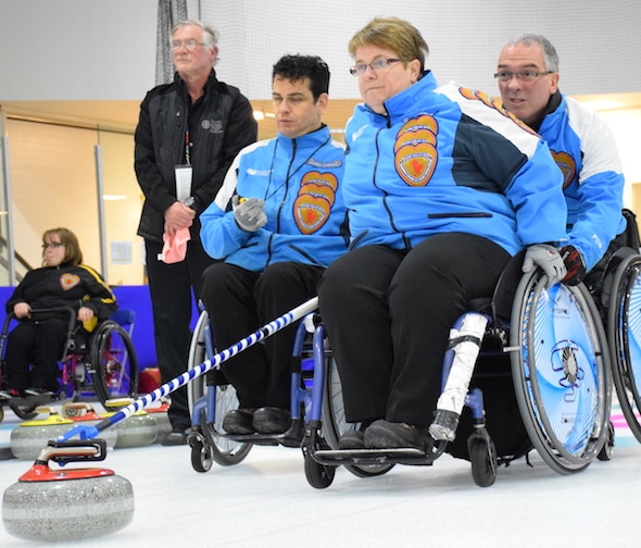 Members of Team Quebec, from left, Carl Marquis, Johanne Daly and Benoit Lessard compete in the 2015 Canadian Wheelchair Championship in Boucherville, Que. (Photo, Curling Canada/Morgan Daw)
