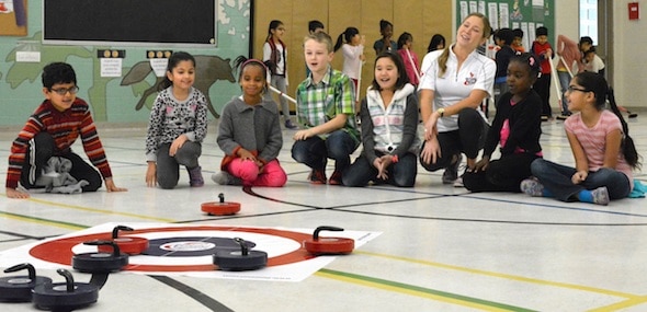 Instructor Kaitlyn Lawes teaches kids the intricacies of curling during an Egg Farmers' Rocks & Rings session