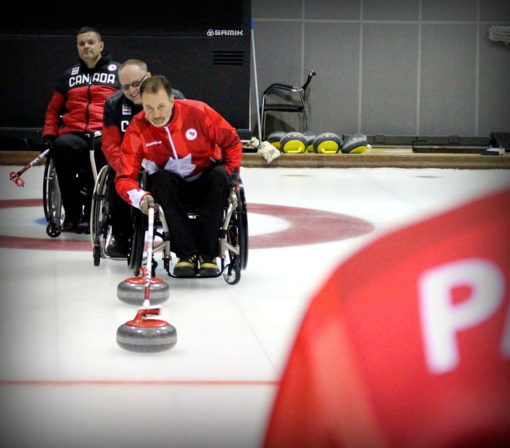 Jamie Anseeuw delivers a rock in practice prior to the 2018 Paralympics (Photo by Brian Chick - Curling Canada).