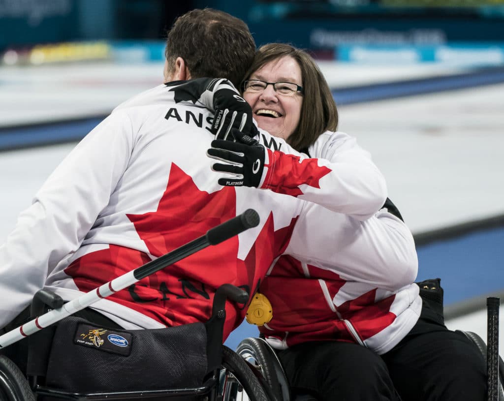 PyeongChang 14/3/2018 - Hugs for the win as Canada takes on Slovakia in wheelchair curling at the Gangneung Curling Centre during the 2018 Winter Paralympic Games in Pyeongchang, Korea. Photo: Dave Holland/Canadian Paralympic Committee