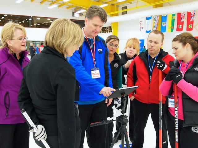 Doug Marks comments on a video recording of a teammates alignment during delivery. (Photo by Lisa Shamchuk)