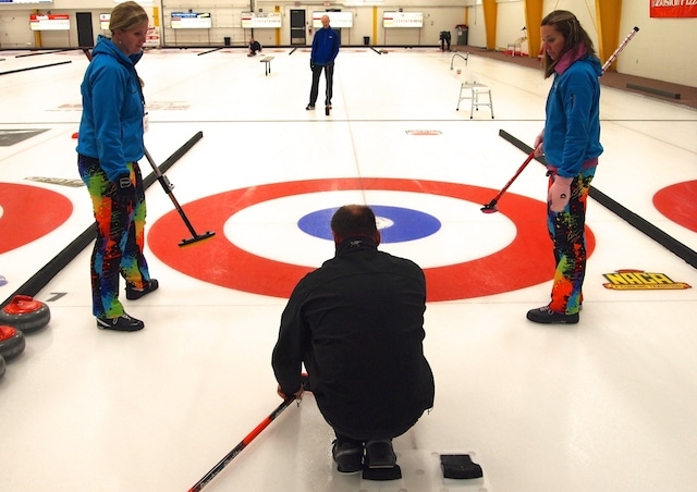 Curlers practice under the watchful eye of their coach (Photo Lisa Shamchuk)