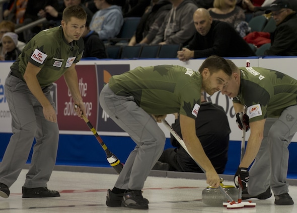 Skip Mike McEwen, left, along with teammates Matt Wozniak, middle, Denni Neufeld, right, and B.J. Neufeld (not pictured) won the Canad Inns Men’s Classic in Portage la Prairie, Man. (Photo, CCA/Michael Burns)