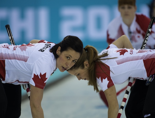 Jill Officer, left, and Kaitlyn Lawes, along with Dawn McEwen (top) and skip Jennifer Jones (not pictured) won the Canad Inns Classic on Monday in Portage la Prairie, Man. (Photo, CCA/Michael Burns)