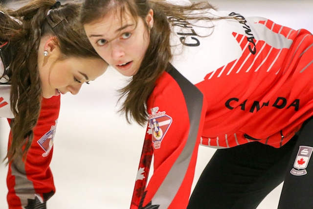 Team Canada’s Janique LeBlanc and Kristin Clarke sweep with intensity during action at the 2016 World Junior Curling Championships in Taarnby, Denmark (WCF/Richard Gray photo)