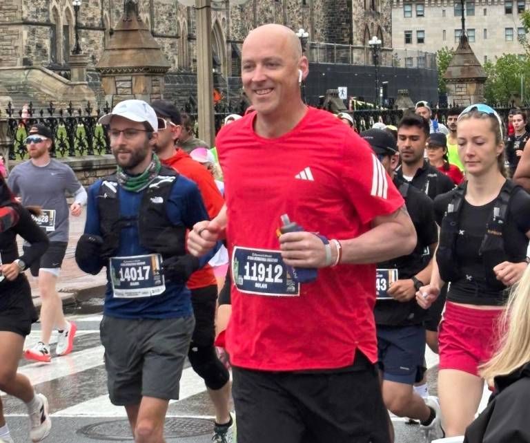 From ice to asphalt: Curling Canada CEO runs marathon in support of youth curling